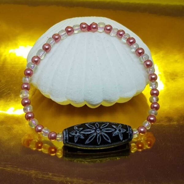 Bracelet with Small Pale Pink and White Beads with a Black and Grey Bead