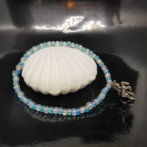 Bracelet with Small Baby Blue and White Beads with a Unicorn Pendant