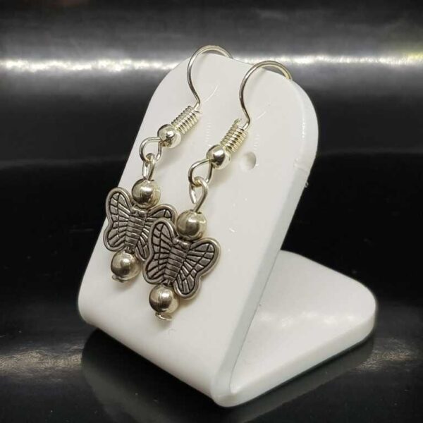 Silver Coloured Hanging Butterfly Earrings on Silver Coloured Posts - Image 3