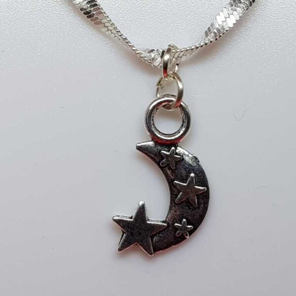 Double Sided Silver Coloured Moon and Star Pendant - Image 3